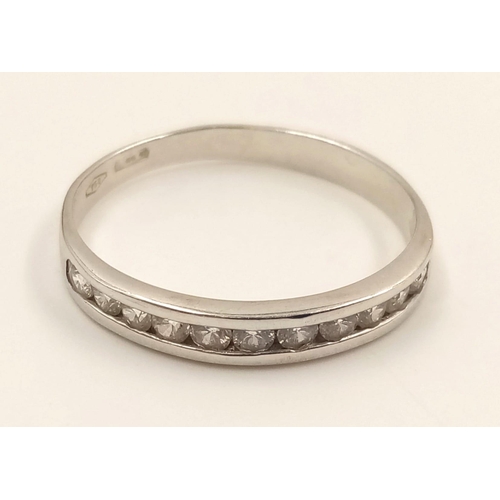 982 - An 18K White Gold Diamond Half-Eternity Ring. Size R.
2.23g