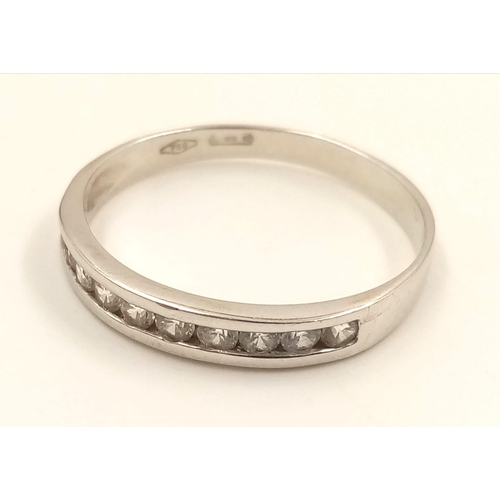 982 - An 18K White Gold Diamond Half-Eternity Ring. Size R.
2.23g