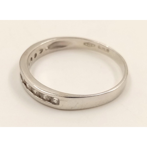 982 - An 18K White Gold Diamond Half-Eternity Ring. Size R.
2.23g