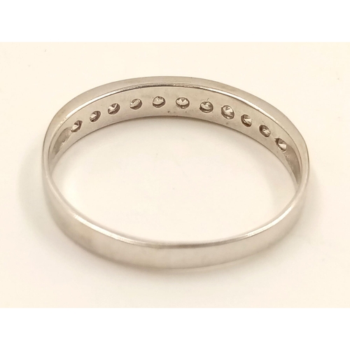 982 - An 18K White Gold Diamond Half-Eternity Ring. Size R.
2.23g