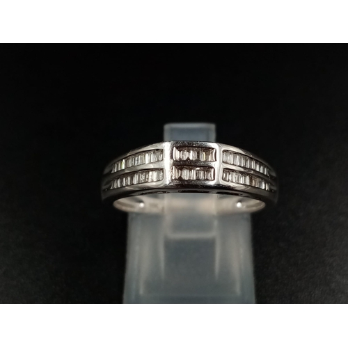 1024 - An 18K White Gold Two-Row Diamond Half-Eternity Ring. Size O. 3.44g