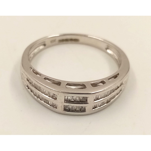 1024 - An 18K White Gold Two-Row Diamond Half-Eternity Ring. Size O. 3.44g