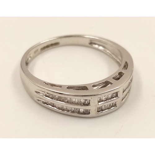 1024 - An 18K White Gold Two-Row Diamond Half-Eternity Ring. Size O. 3.44g