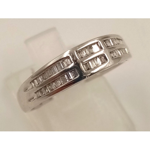 1024 - An 18K White Gold Two-Row Diamond Half-Eternity Ring. Size O. 3.44g