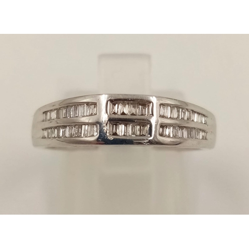 1024 - An 18K White Gold Two-Row Diamond Half-Eternity Ring. Size O. 3.44g