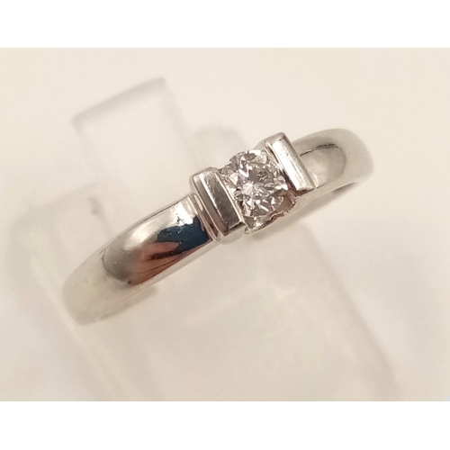 813 - An 18K White Gold Diamond Solitaire Ring. Size L.
2.8g