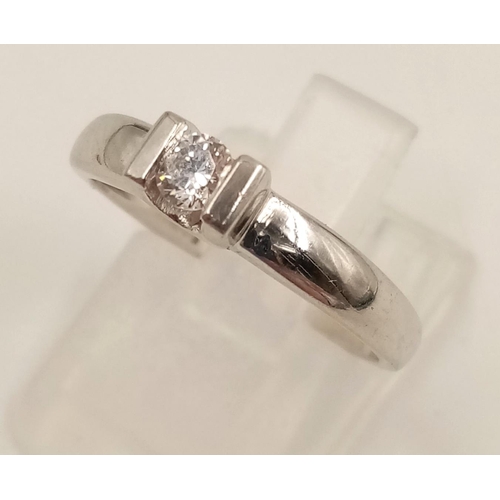 813 - An 18K White Gold Diamond Solitaire Ring. Size L.
2.8g