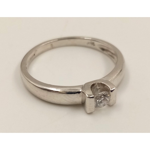 813 - An 18K White Gold Diamond Solitaire Ring. Size L.
2.8g