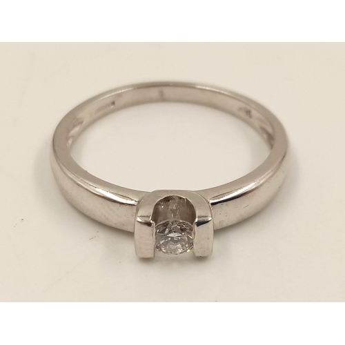 813 - An 18K White Gold Diamond Solitaire Ring. Size L.
2.8g