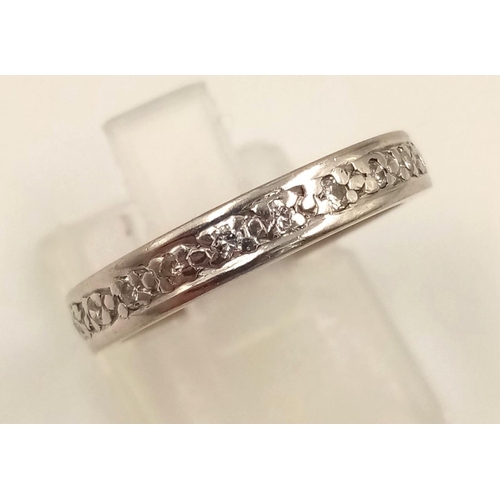 624 - An 18K White Gold Diamond Eternity Ring. Size M.
4.38g.