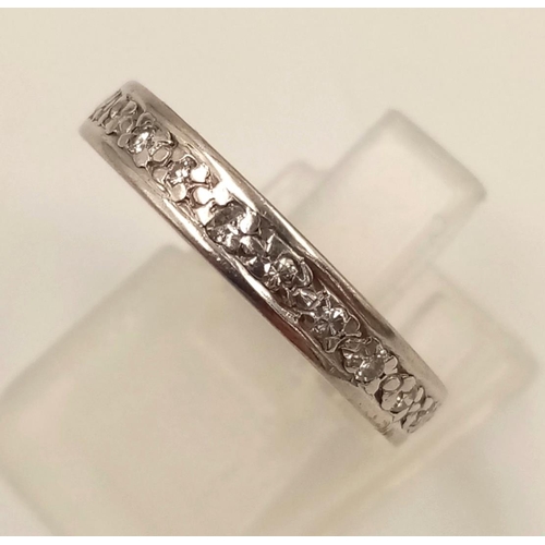 624 - An 18K White Gold Diamond Eternity Ring. Size M.
4.38g.