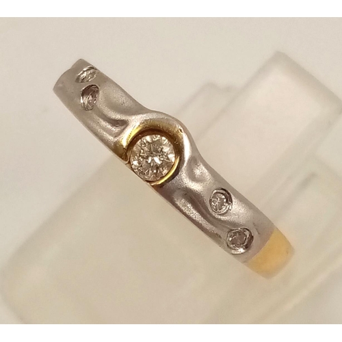 834 - An 18K Yellow and White Gold Diamond Ring. Size L1/2.
2.23g