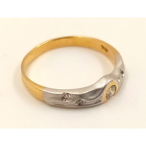 834 - An 18K Yellow and White Gold Diamond Ring. Size L1/2.
2.23g