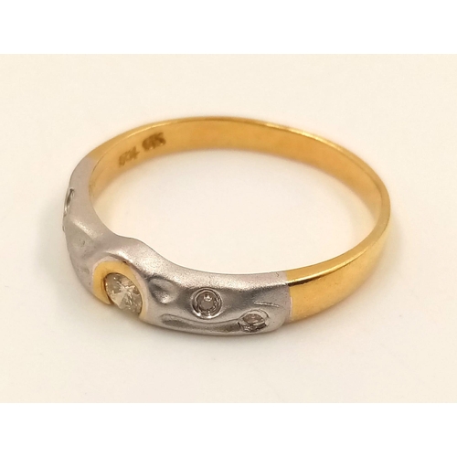 834 - An 18K Yellow and White Gold Diamond Ring. Size L1/2.
2.23g