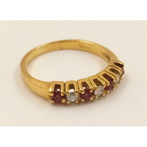 974 - An 18K Yellow Gold Ruby and Diamond Ring. Seven stones. Size I. 2.27g