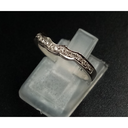 1010 - An 18k White Gold Diamond Half-Eternity Ring. Size L.
2.5g.