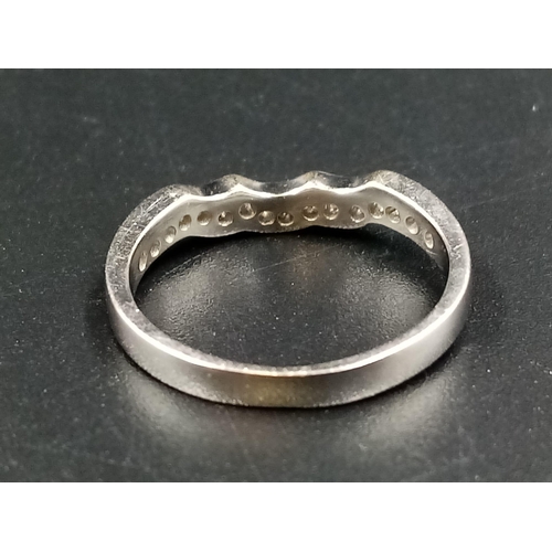 1010 - An 18k White Gold Diamond Half-Eternity Ring. Size L.
2.5g.