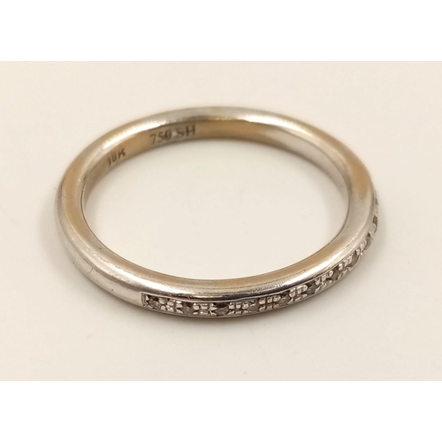 736 - An 18k White Gold Diamond Half-Eternity Ring. Size N.
3.24g