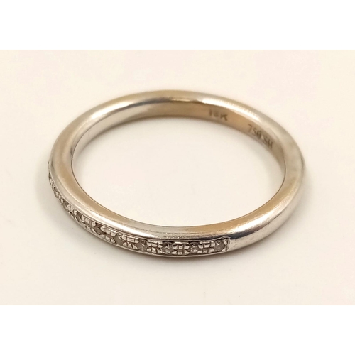 736 - An 18k White Gold Diamond Half-Eternity Ring. Size N.
3.24g