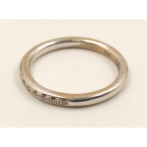 736 - An 18k White Gold Diamond Half-Eternity Ring. Size N.
3.24g