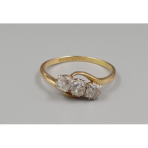 450 - An 18K Yellow Gold Three Diamond Ring. 0.75ct. Size P.
2.3g