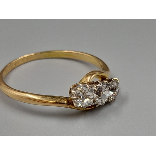 450 - An 18K Yellow Gold Three Diamond Ring. 0.75ct. Size P.
2.3g