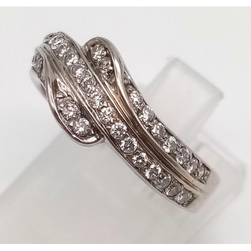 743 - An 18K White Gold Three-Row Diamond Half-Eternity Ring. Size N. 4.97g