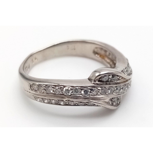 743 - An 18K White Gold Three-Row Diamond Half-Eternity Ring. Size N. 4.97g