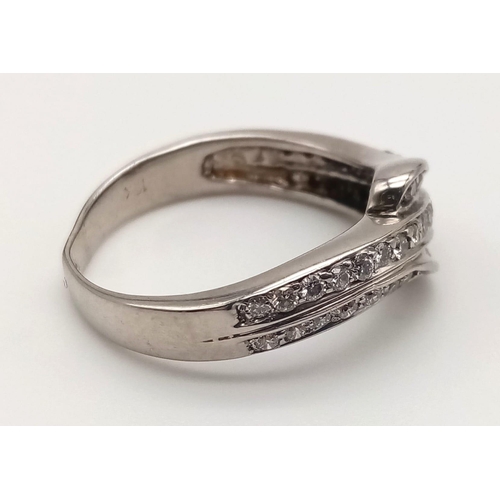 743 - An 18K White Gold Three-Row Diamond Half-Eternity Ring. Size N. 4.97g