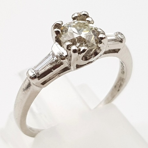 464 - A Platinum Diamond Solitaire Ring. Beautiful round-cut 1ct diamond on platform shoulders. Size K. 3.... 