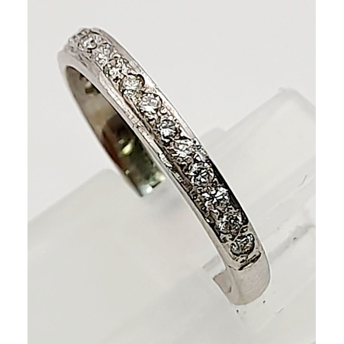 989 - A Platinum Diamond Half-Eternity Ring. 0.50ct. Size K.
2.57g total weight.