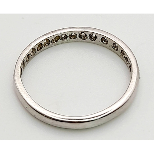 989 - A Platinum Diamond Half-Eternity Ring. 0.50ct. Size K.
2.57g total weight.