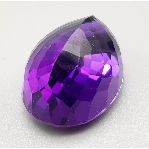 1278 - A Beautiful 28ct Deep Purple Coloured Gemstone. Oval cut. 15 x 20mm. No certificate so as found.