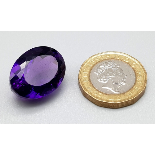 1278 - A Beautiful 28ct Deep Purple Coloured Gemstone. Oval cut. 15 x 20mm. No certificate so as found.