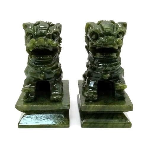 1379 - A Pair of Green Miniature Jade Foo Dog Figures. 6.5cm tall.