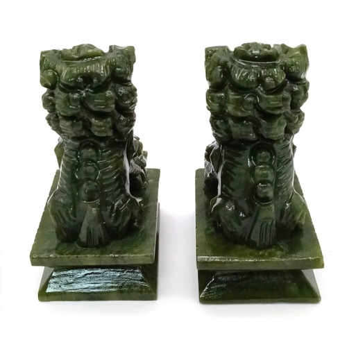 1379 - A Pair of Green Miniature Jade Foo Dog Figures. 6.5cm tall.