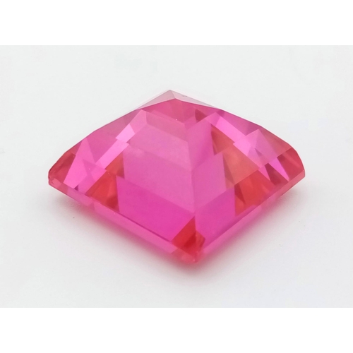 394 - A 46ct Pink/Red-Ruby Coloured Gemstone. Pyramid step cut.  20 x 20mm. No certificate so as found.