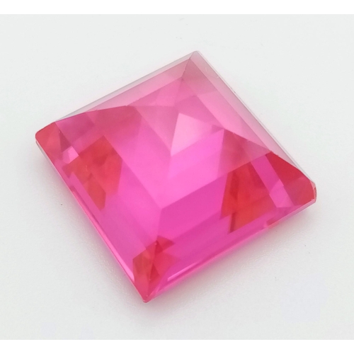 394 - A 46ct Pink/Red-Ruby Coloured Gemstone. Pyramid step cut.  20 x 20mm. No certificate so as found.