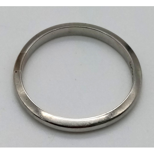 530 - An 18K White Gold Band Ring. Size N/O. 2.38g