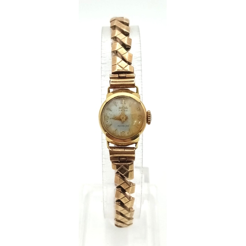 550 - An Avia 18K Gold Cased Ladies Watch. In need of repair so A/F. 15.95g total weight.