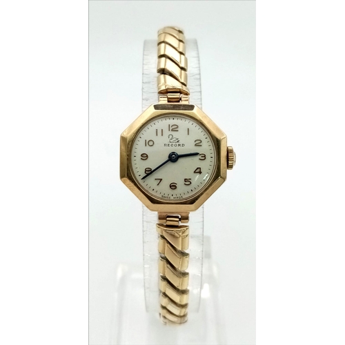 580 - A Vintage 9K Yellow Gold Cased Record Ladies Watch. Expandable gold plated strap. Octagon case. Mech... 