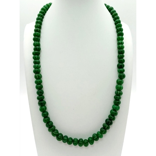 716 - A Green Jade Rondelle Beaded Necklace. 50cm. 8mm beads.