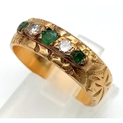 79 - A Vintage 18K Yellow Gold Emerald and Diamond Five Stone Ring. Decorative band with three emeralds a... 