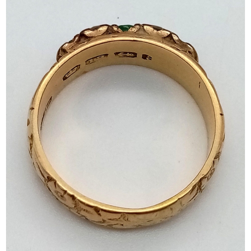 79 - A Vintage 18K Yellow Gold Emerald and Diamond Five Stone Ring. Decorative band with three emeralds a... 