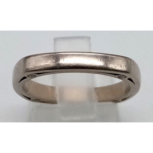 85 - An 18K White Gold Modern Eternity Ring. A Circle in a square adjoined by eight small round cut diamo... 