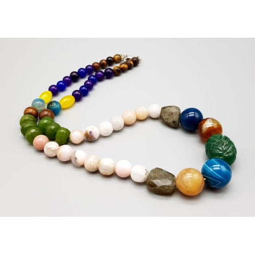 942 - An Emerald, Jade and Onyx Multi-Coloured Beaded Necklace. With also amethyst, tiger eye, opal and la... 