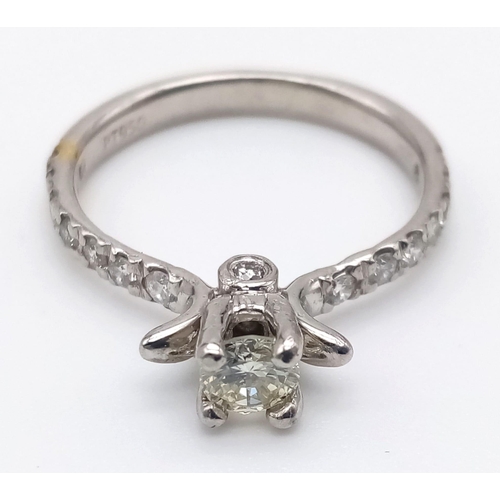 403 - A Platinum and Diamond Ring. Central diamond with diamonds on shoulders. 0.35 and 0.25ct. Size L.
4.... 