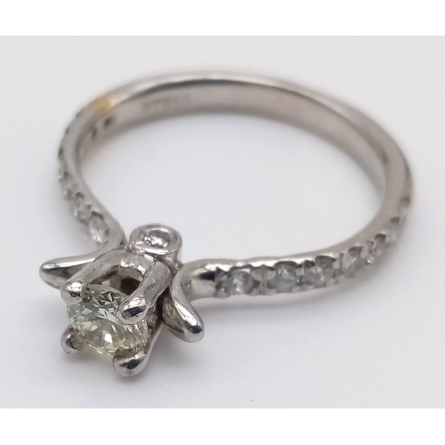 403 - A Platinum and Diamond Ring. Central diamond with diamonds on shoulders. 0.35 and 0.25ct. Size L.
4.... 