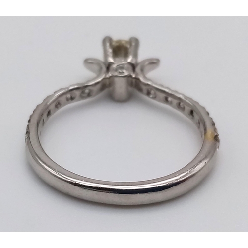 403 - A Platinum and Diamond Ring. Central diamond with diamonds on shoulders. 0.35 and 0.25ct. Size L.
4.... 