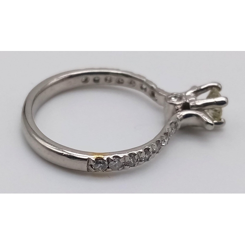 403 - A Platinum and Diamond Ring. Central diamond with diamonds on shoulders. 0.35 and 0.25ct. Size L.
4.... 